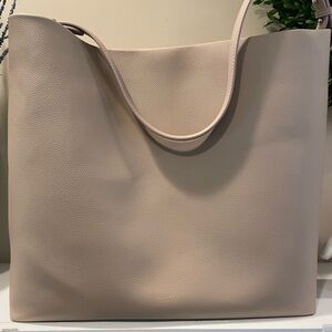 Mina Baie brand tan vegan bag/diaper bag. Unused.  Comes with multiple handles.